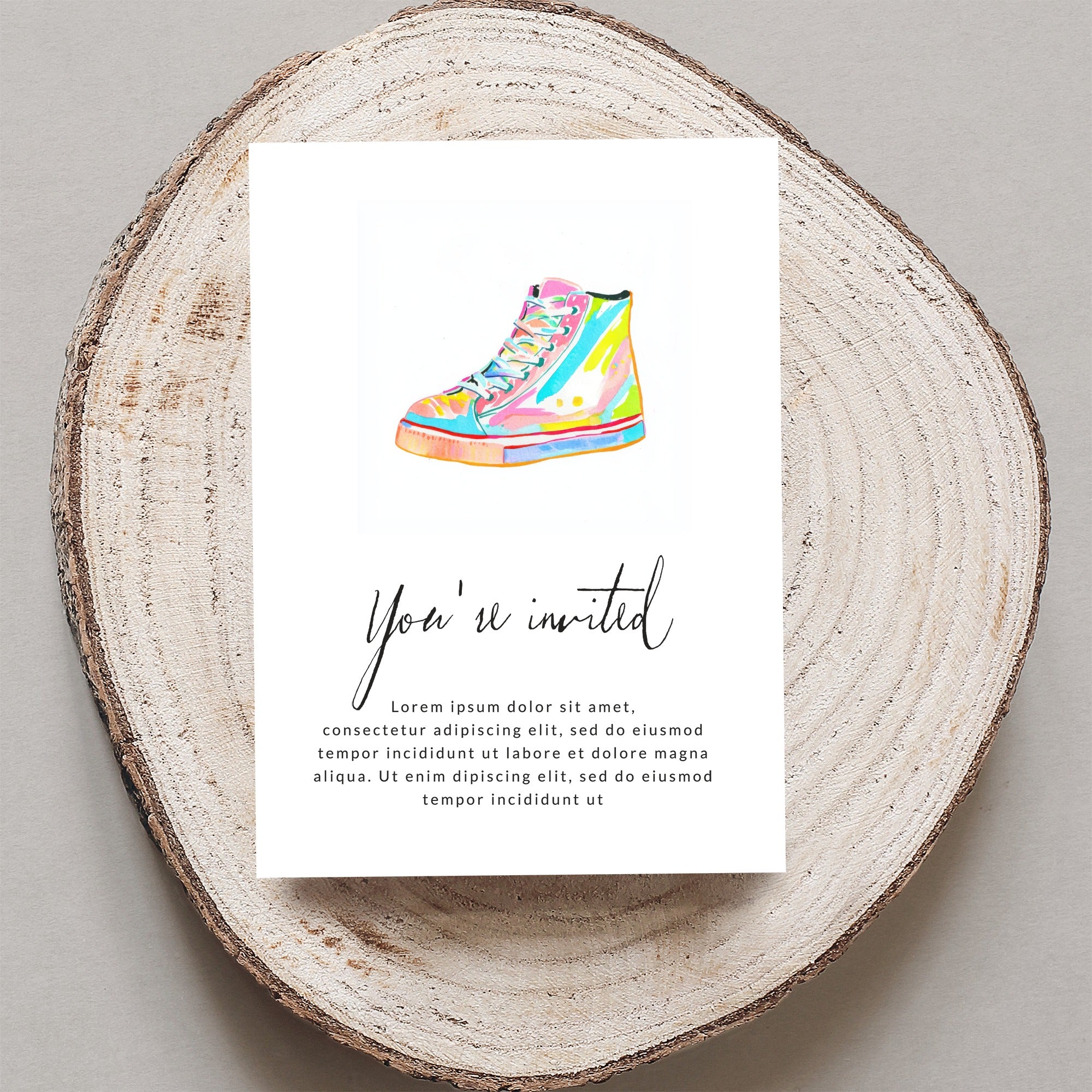 Colorful high-top sneaker on invitation with "You're invited" text.