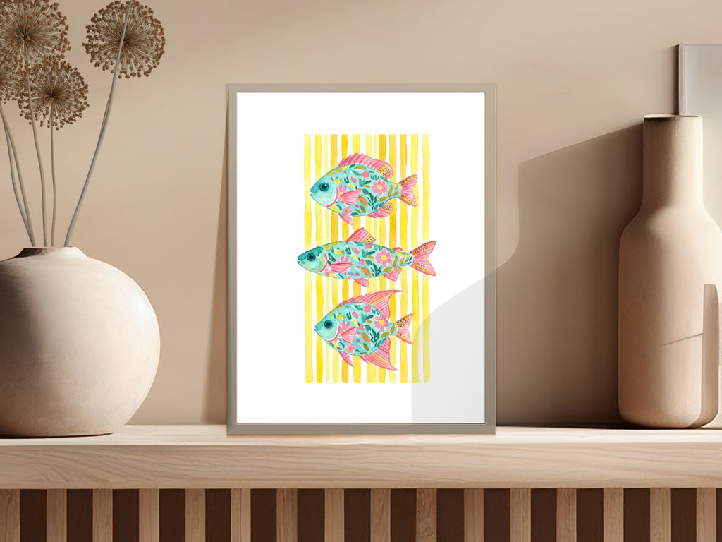 Three colorful, stylized fish with striped backgrounds in a framed print.