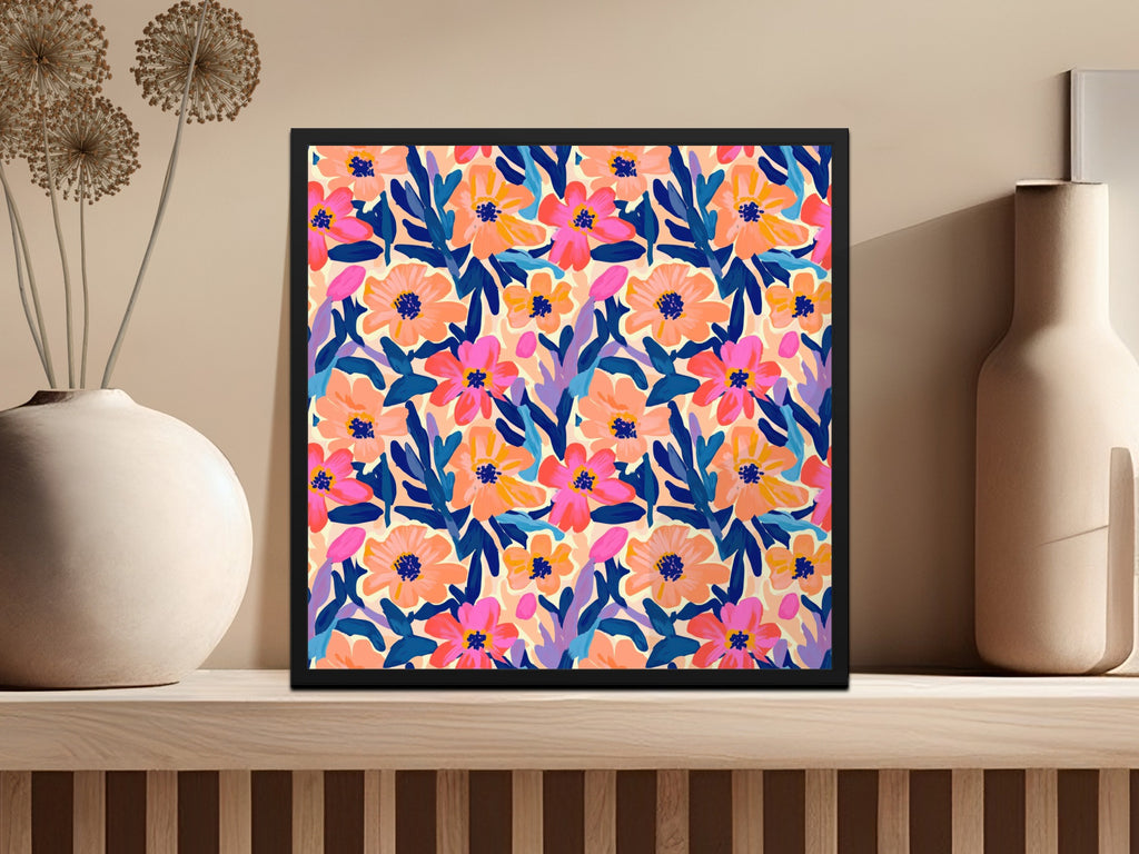 Colorful floral pattern artwork in a black frame on a shelf.
