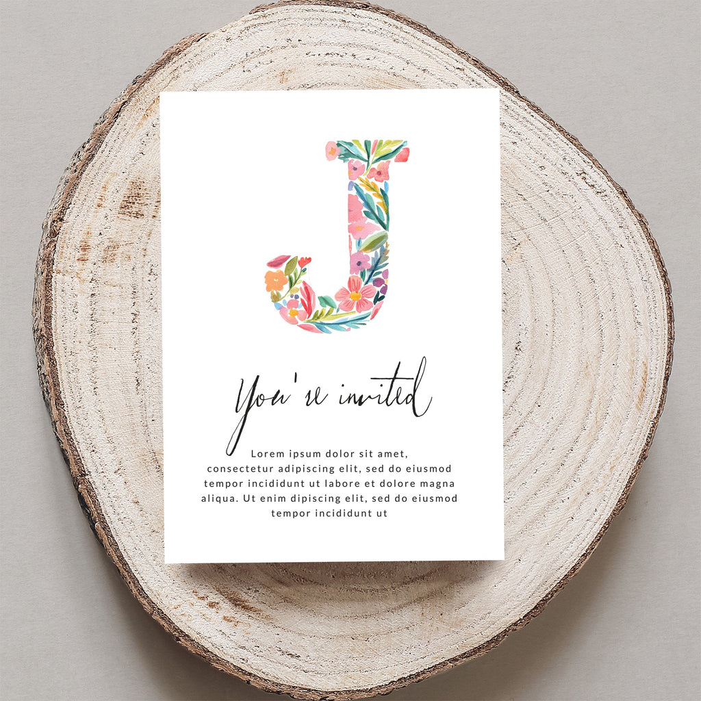 Floral initial 'J' on an invitation with "You're invited" text.