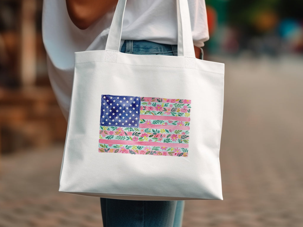 White tote bag with an American flag design made of floral patterns.