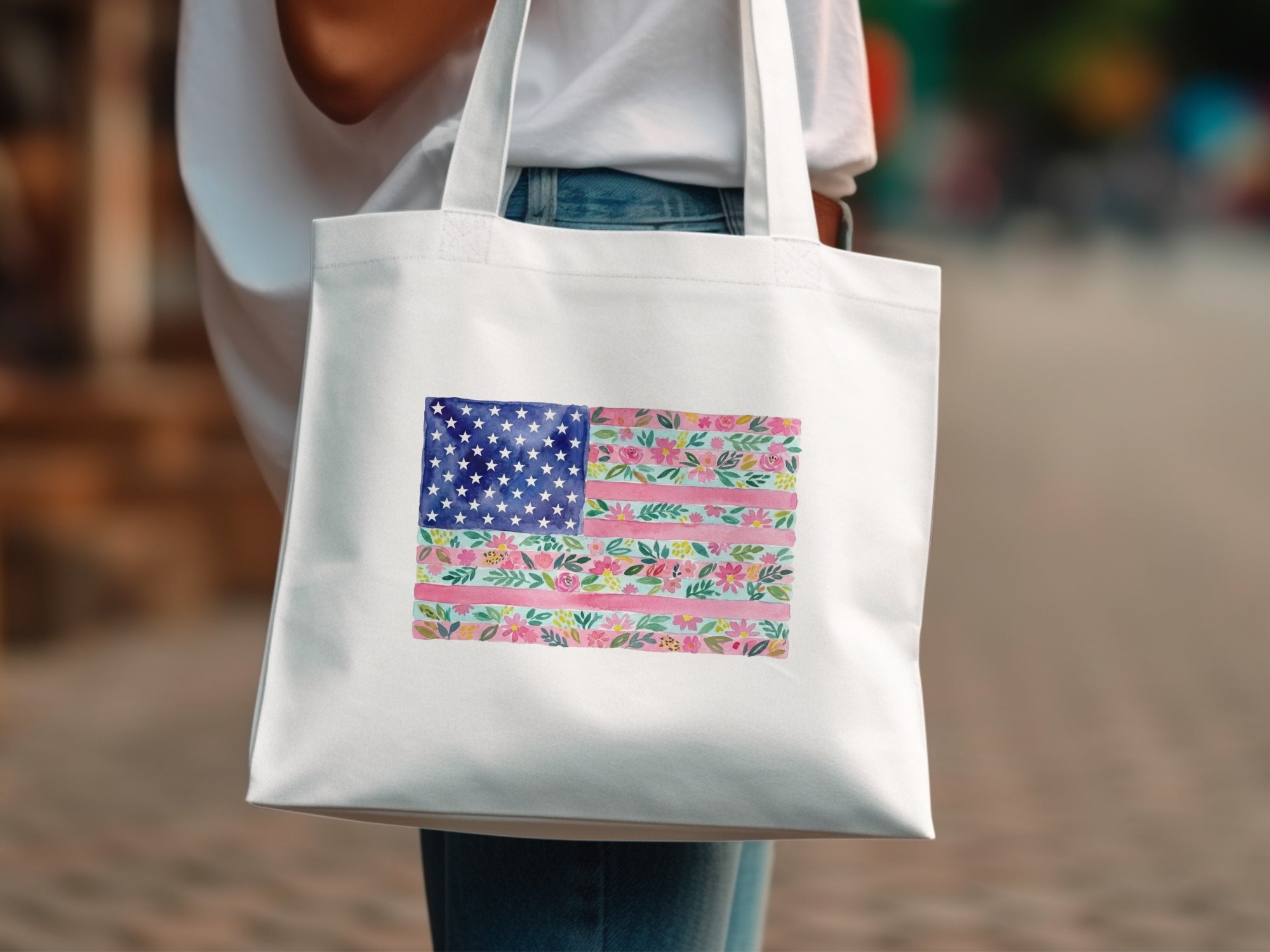 White tote bag with an American flag design made of floral patterns.