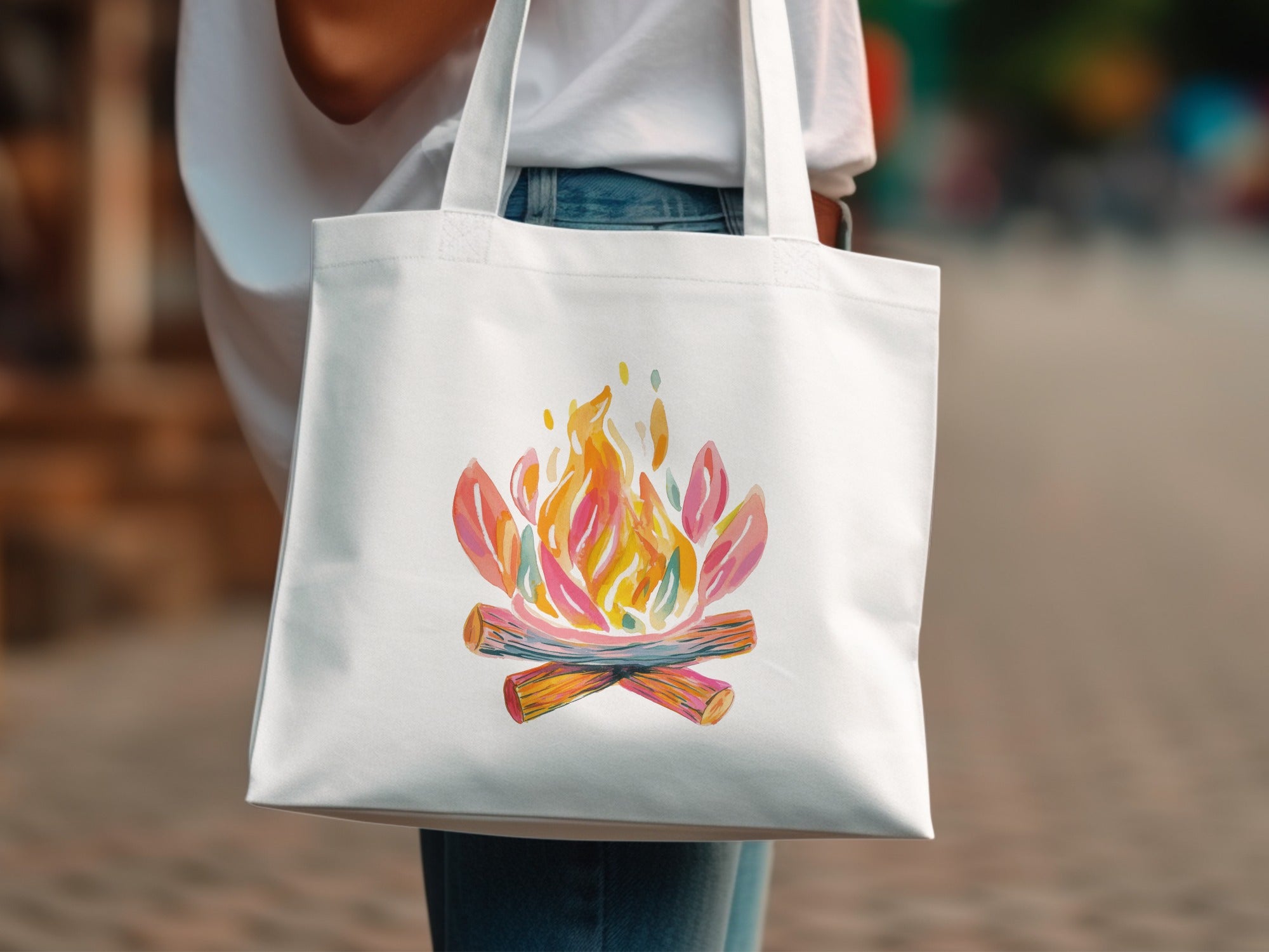 White tote bag with watercolor campfire design.