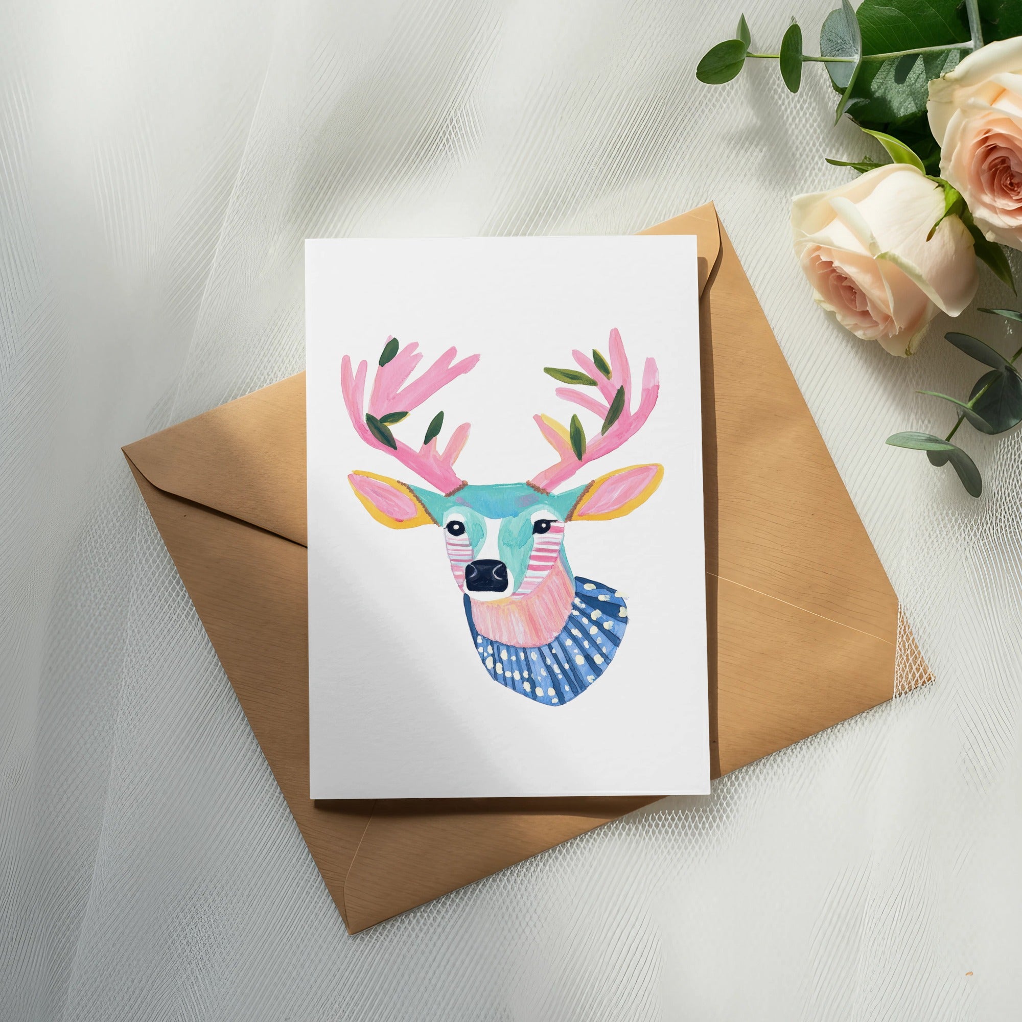 Watercolor greeting card with a stylized deer head and brown envelope.