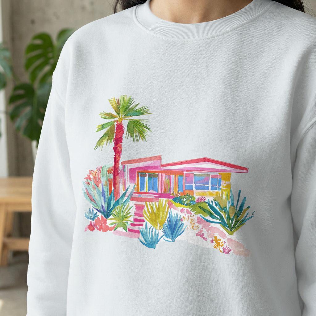 Watercolor illustration of a pink mid-century modern house with lush landscaping.