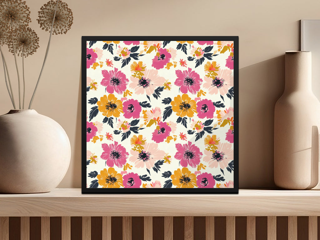Framed artwork with a colorful floral pattern hangs on a shelf.