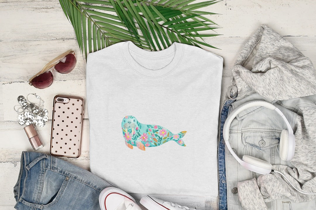 White t-shirt with a watercolor floral seal design.