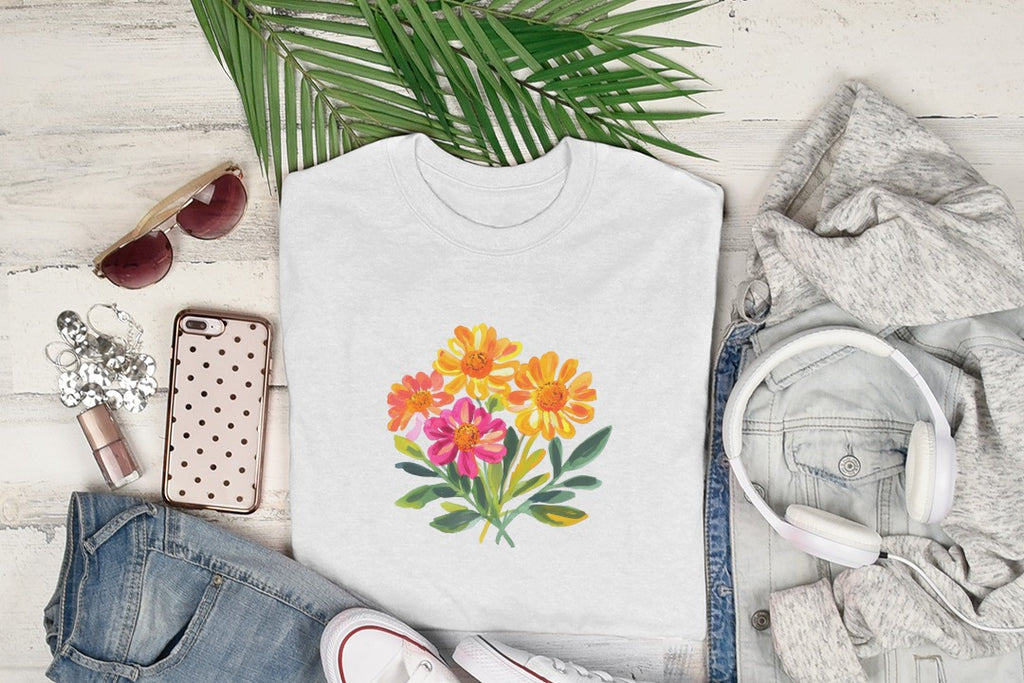 White t-shirt with colorful floral print and casual clothing flat lay.