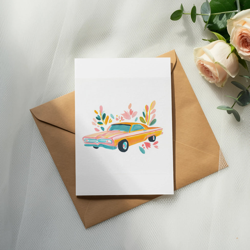 Watercolor illustration of a vintage orange car with floral accents on a white card.