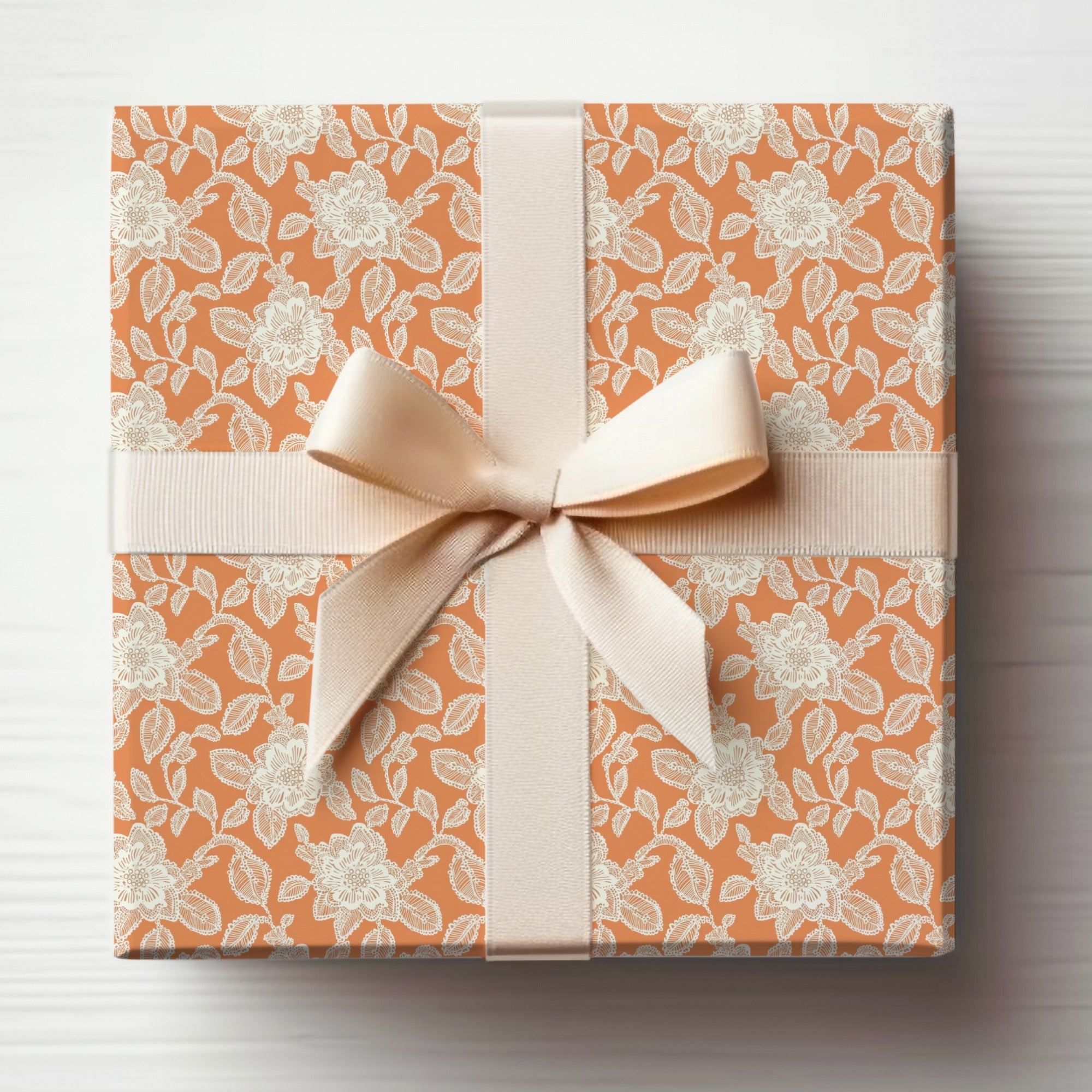 Elegant Floral Patterned Gift Wrap with Beige Ribbon