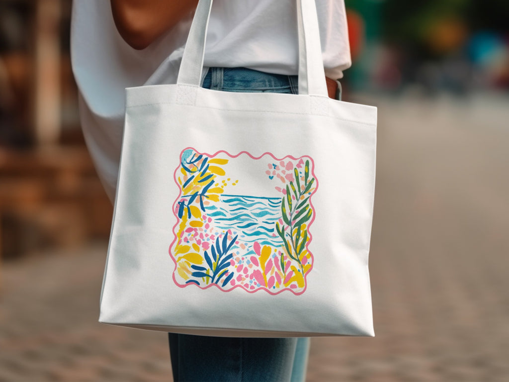 White tote bag with a colorful abstract floral and wave pattern.