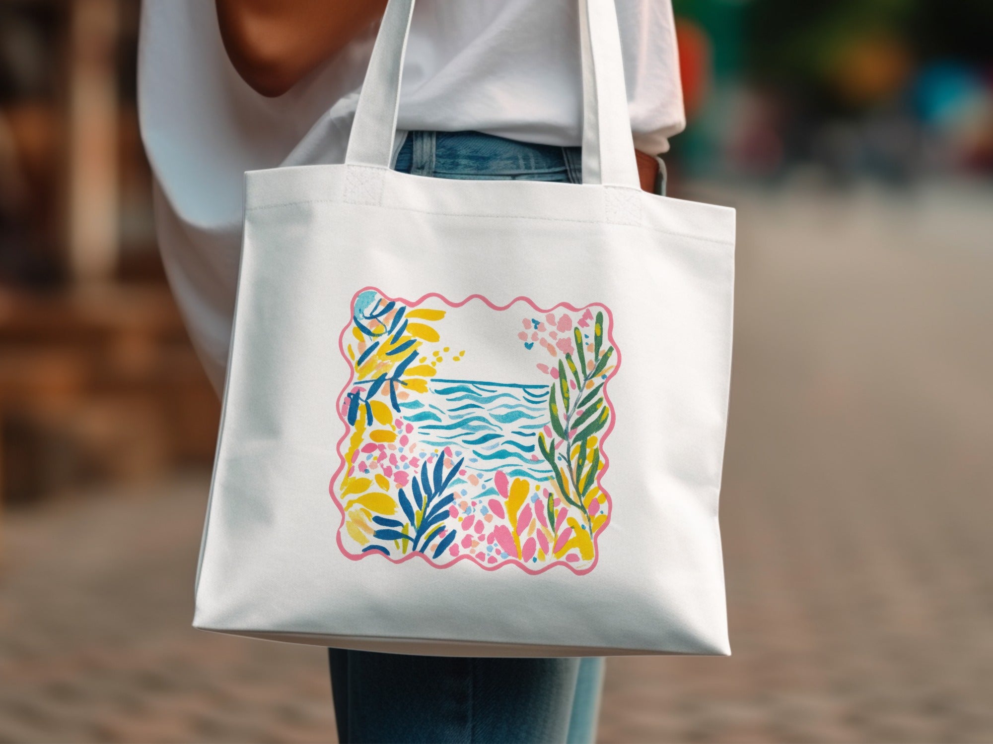 White tote bag with a colorful abstract floral and wave pattern.