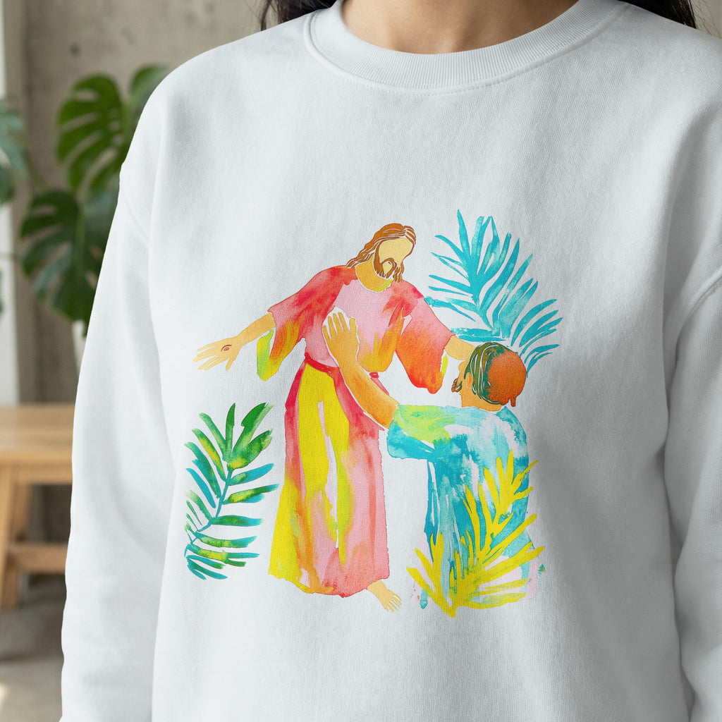 Jesus reaching out to a kneeling person surrounded by colorful leaves.