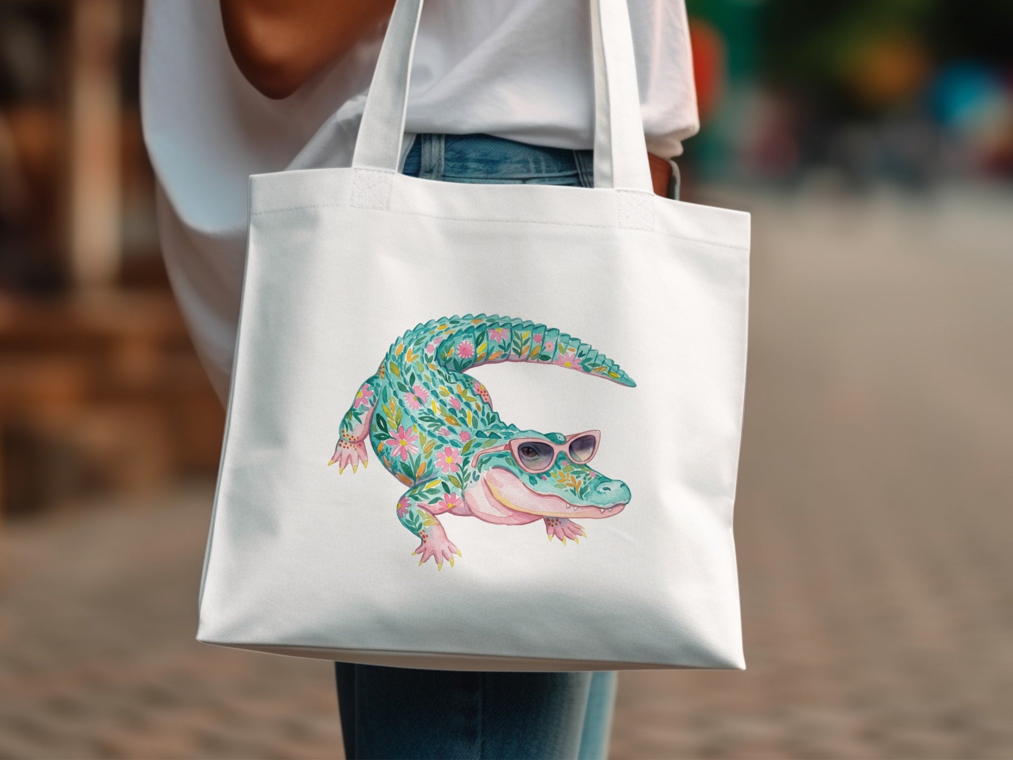 White tote bag with a floral alligator wearing sunglasses.