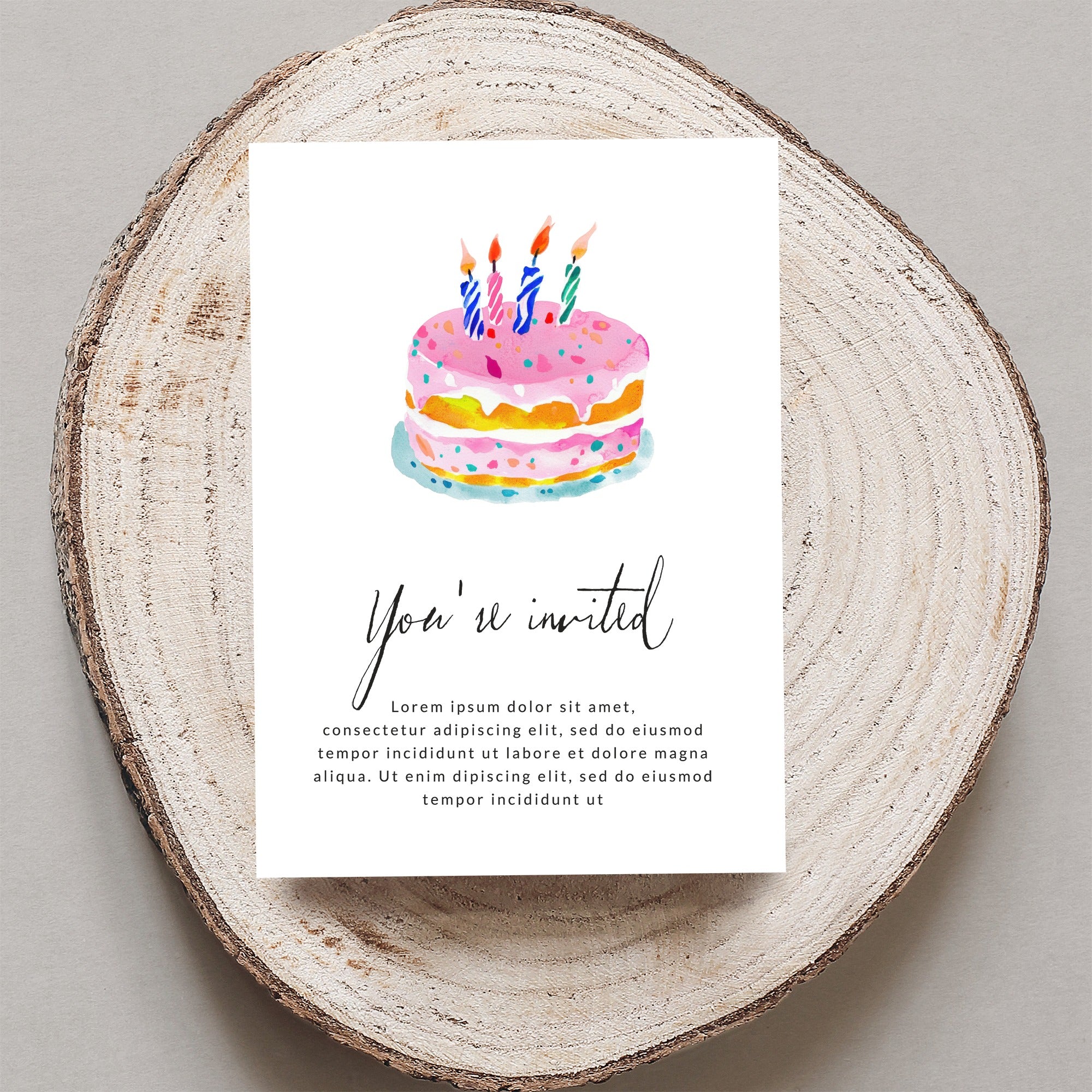 Watercolor birthday cake invitation with "You're invited" text.