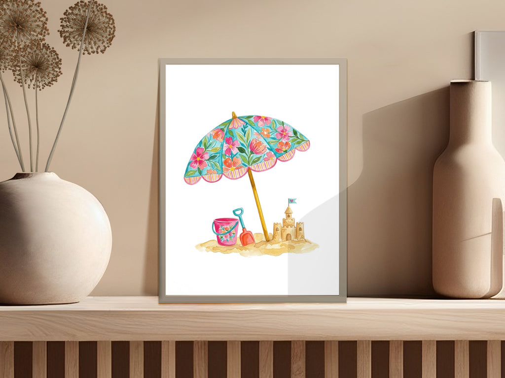 Watercolor painting of a beach umbrella, sandcastle, and toys on a shelf.