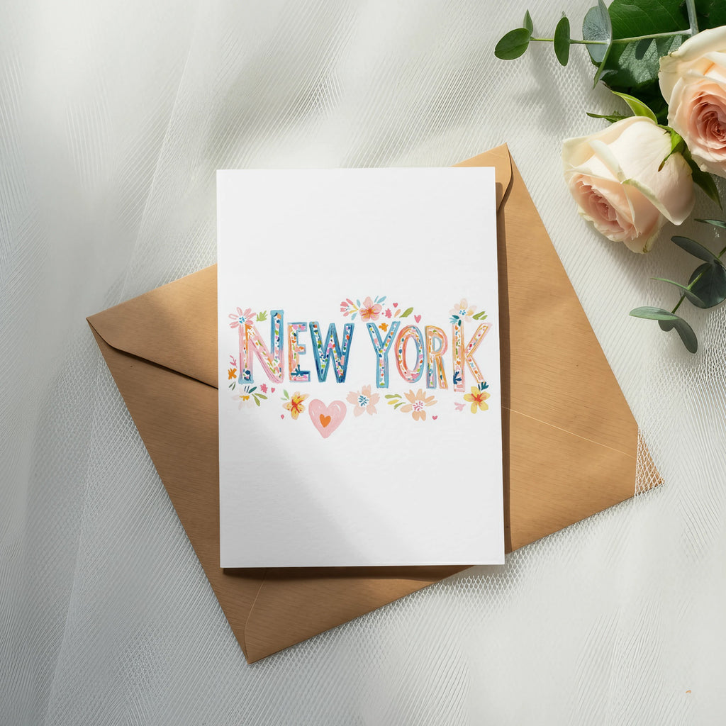 Greeting card with "New York" in colorful floral lettering on an envelope.