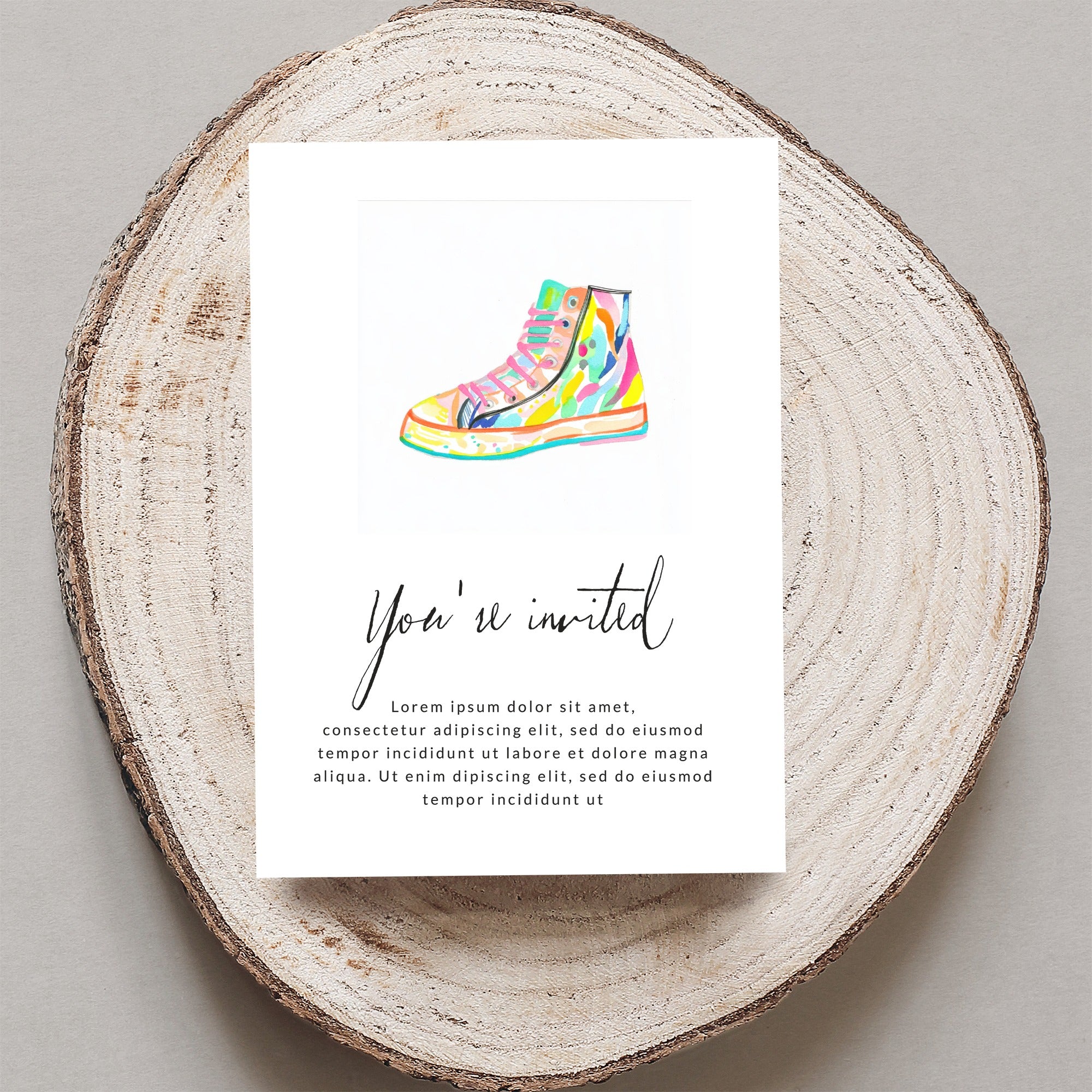 Colorful sneaker illustration on invitation card with "You're invited" text.