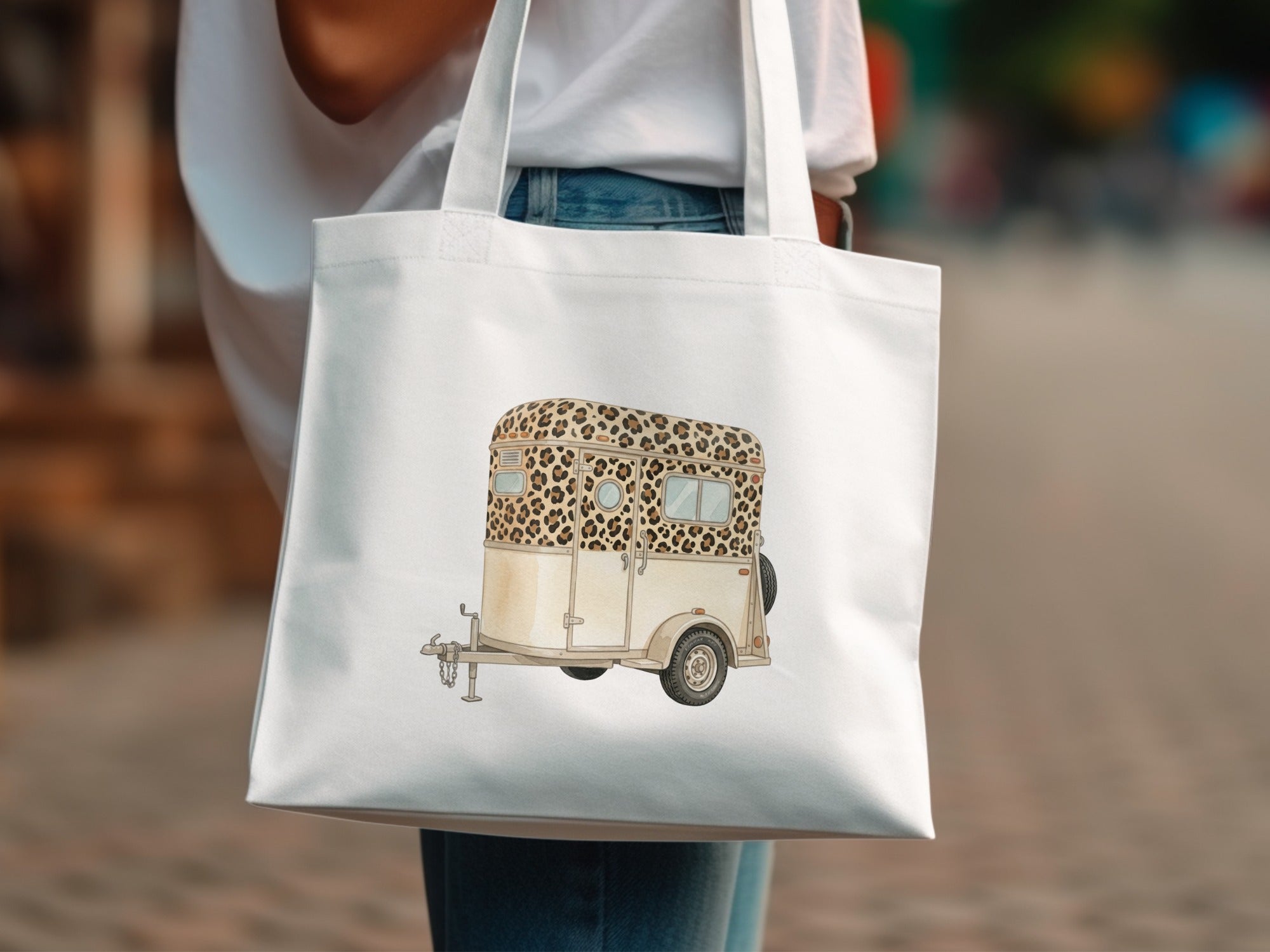 Tote bag with leopard print horse trailer design.