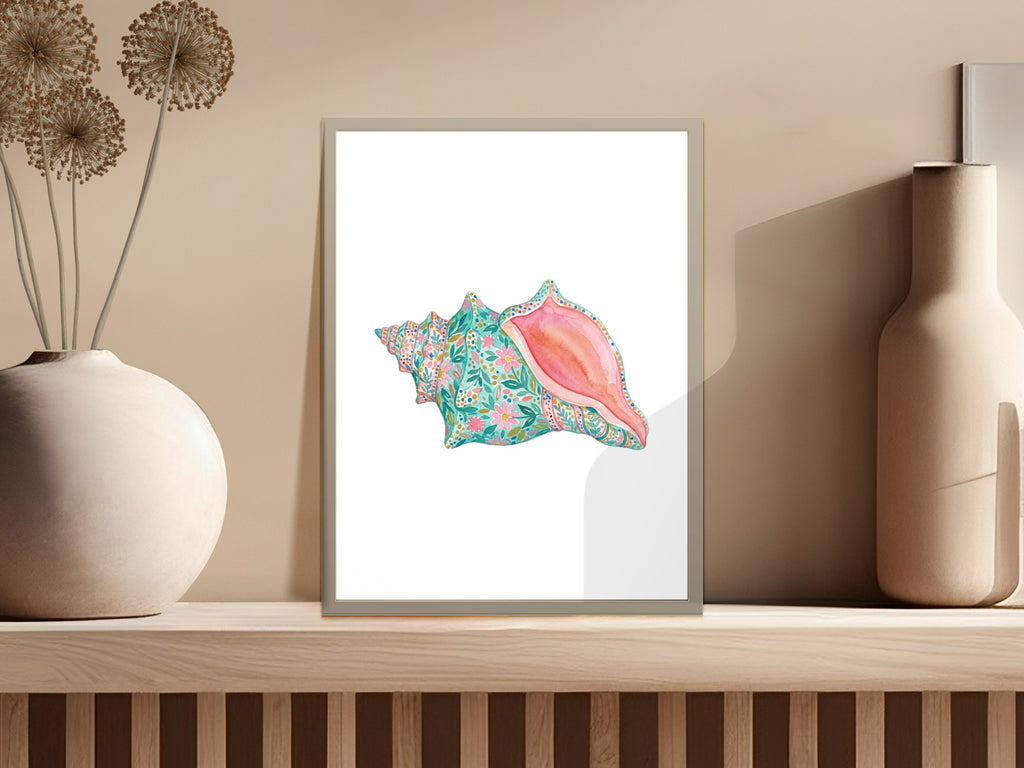 Watercolor painting of a pink conch shell with colorful floral patterns.
