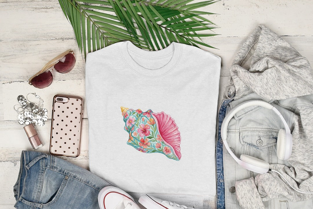 White t-shirt with a pink conch shell and floral design.