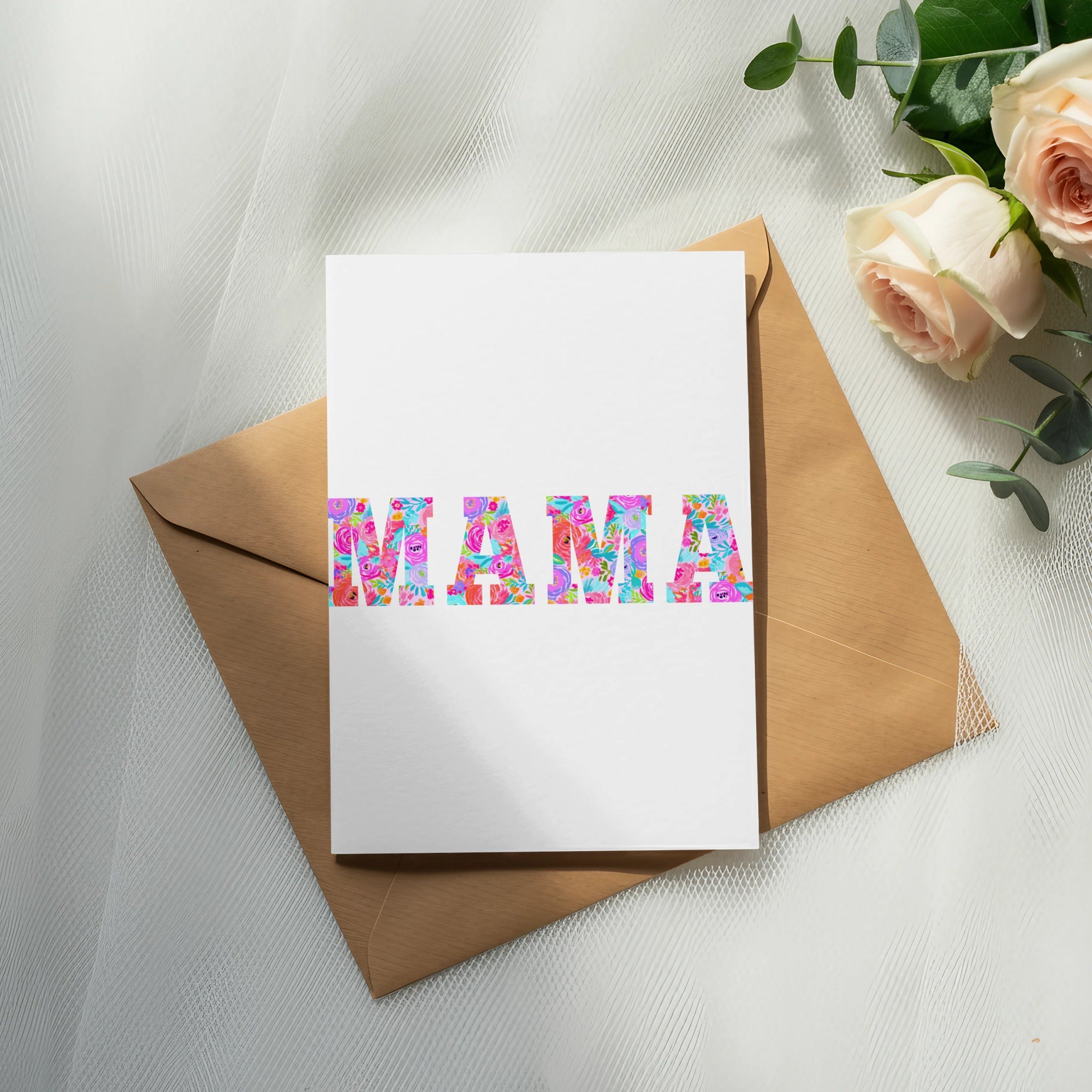 Card with "MAMA" in colorful floral letters on a brown envelope.