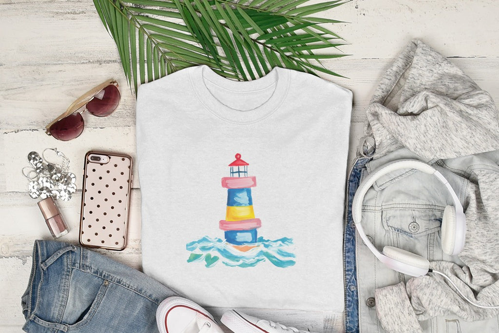 White t-shirt with watercolor lighthouse design on wavy blue and yellow water.