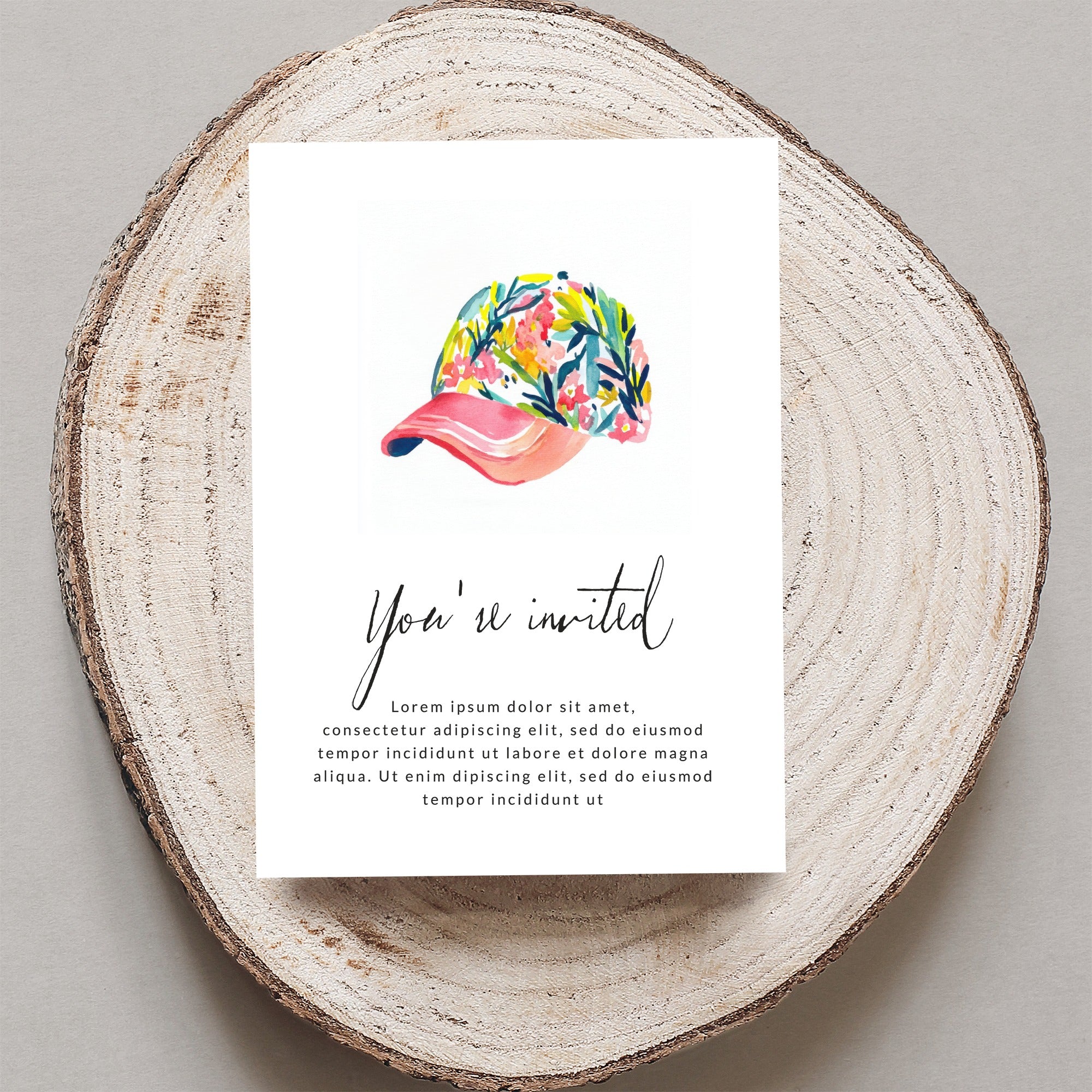 Invitation card with floral baseball cap illustration and placeholder text.