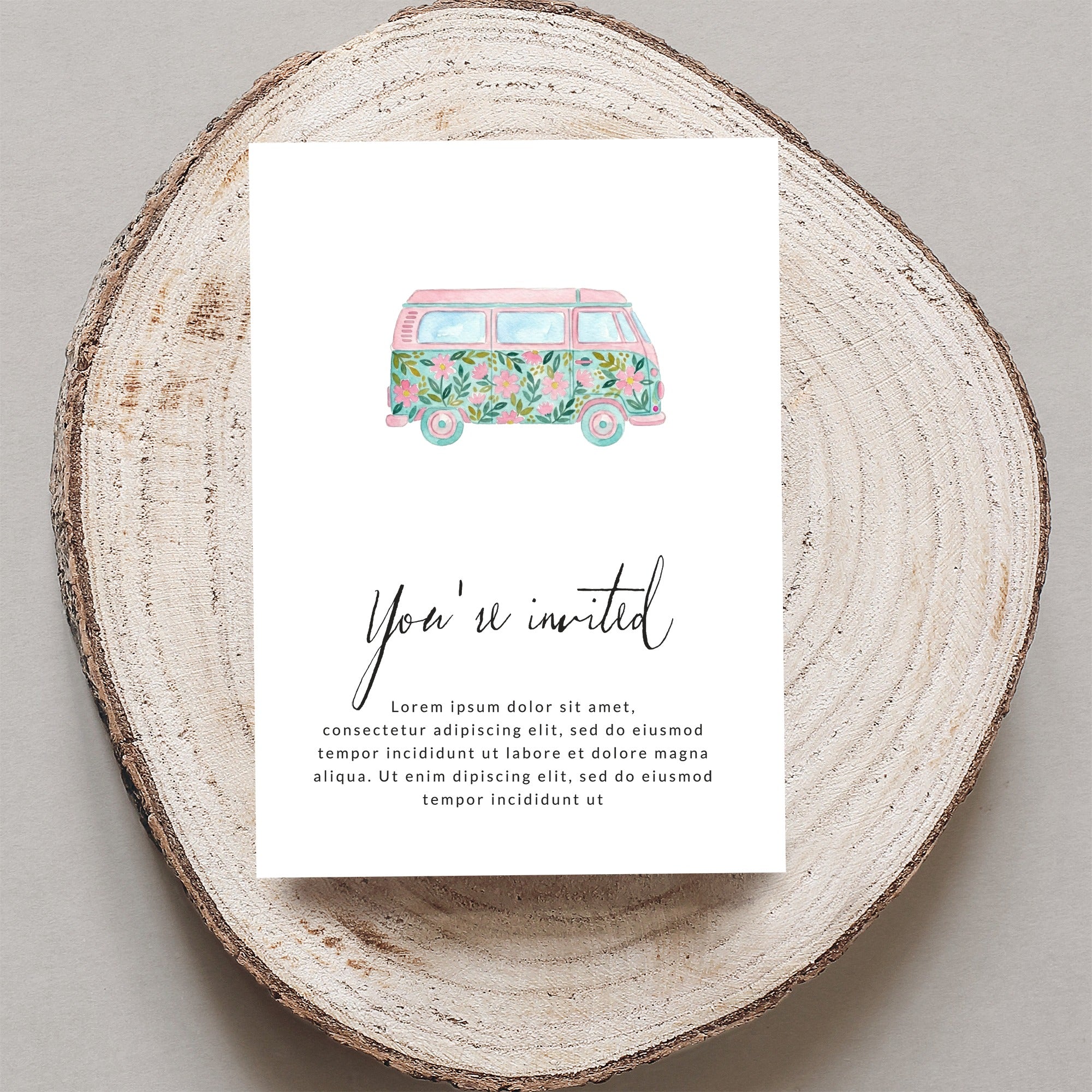 Invitation with floral watercolor van and "You're invited" text.