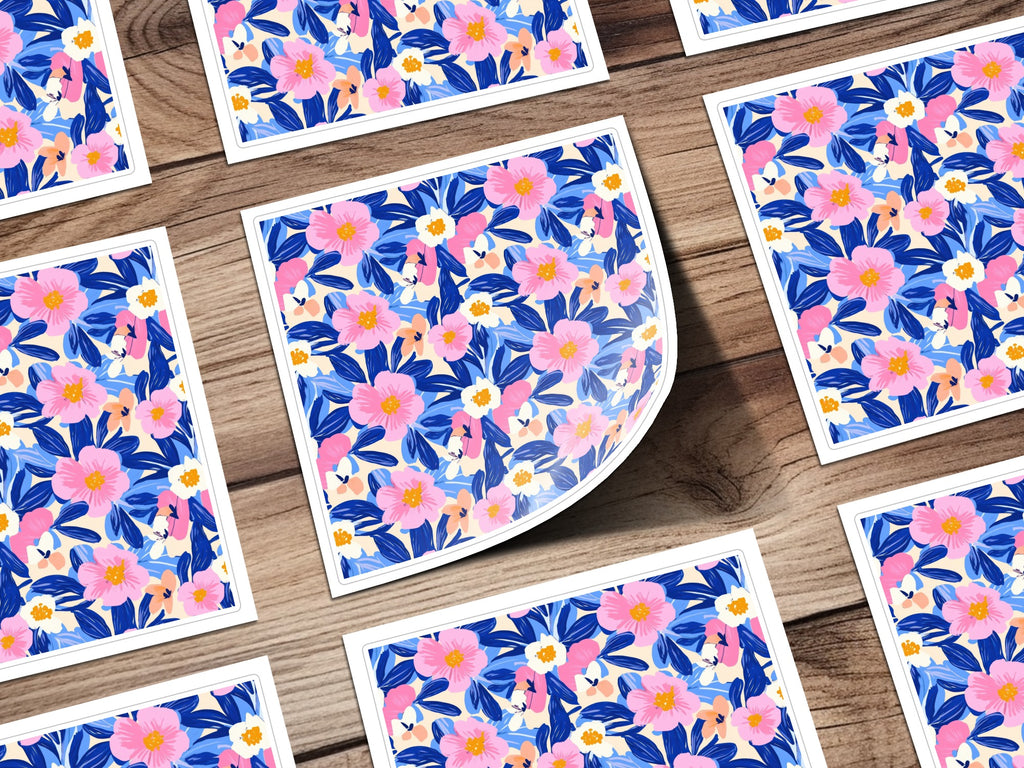 Scattered floral print cards on a wooden background.