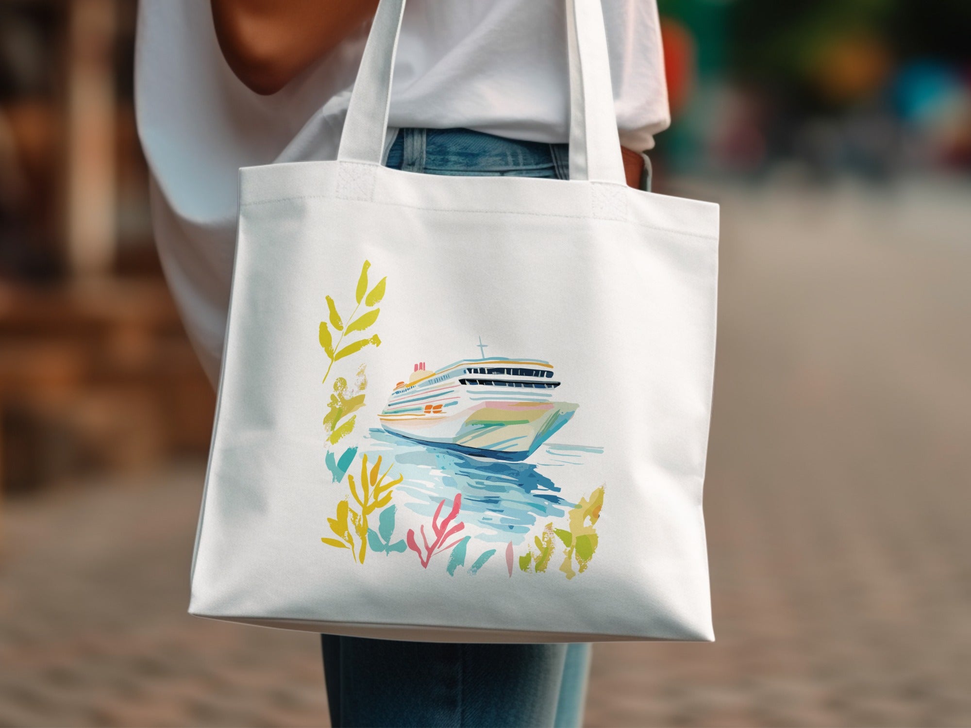 White canvas tote bag with watercolor painting of a cruise ship and colorful foliage.