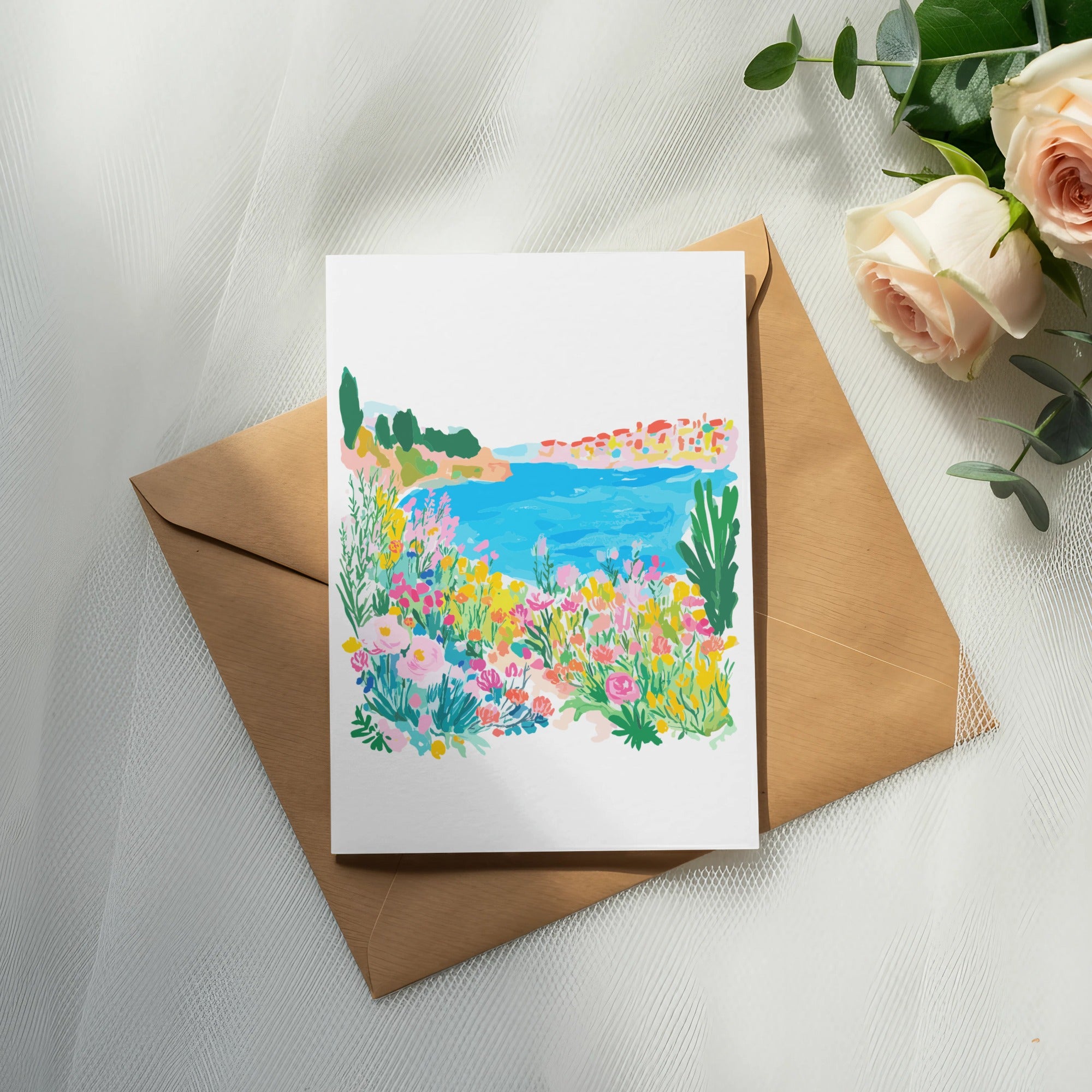 Watercolor painting of a coastal village with flowers and foliage on a brown envelope.