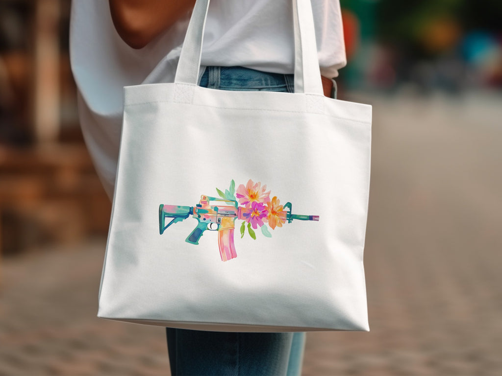 White tote bag with watercolor floral design on an assault rifle.