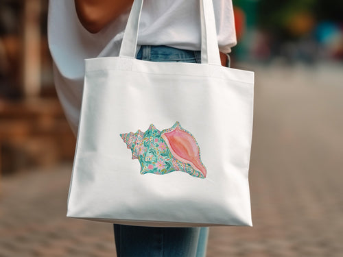 White tote bag with a colorful seashell design featuring floral accents.