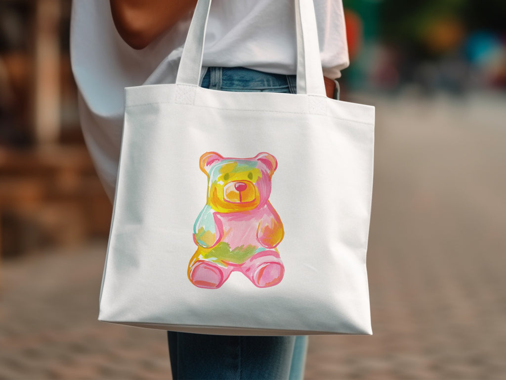 White canvas tote bag with watercolor gummy bear illustration.