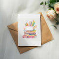 Blank card with books and pencils on a brown envelope.