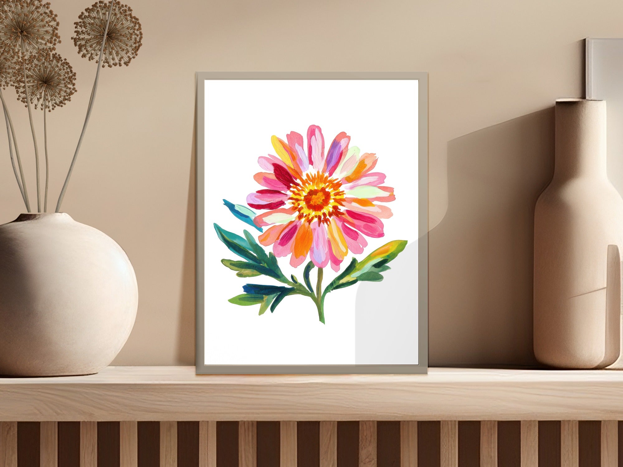 Watercolor painting of a vibrant pink and orange dahlia flower with green leaves.