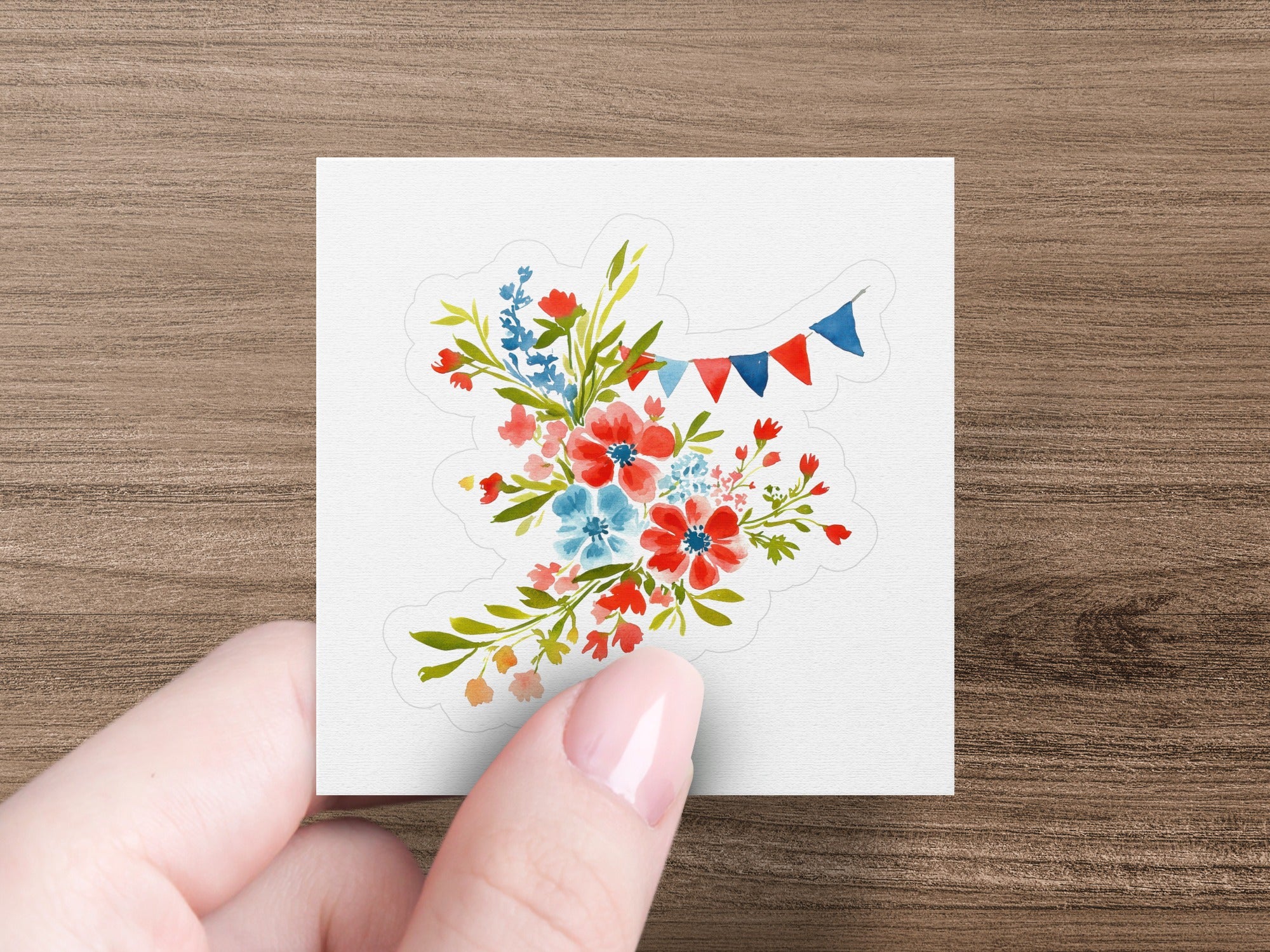 Floral bouquet with red, blue, and white bunting on a sticker.