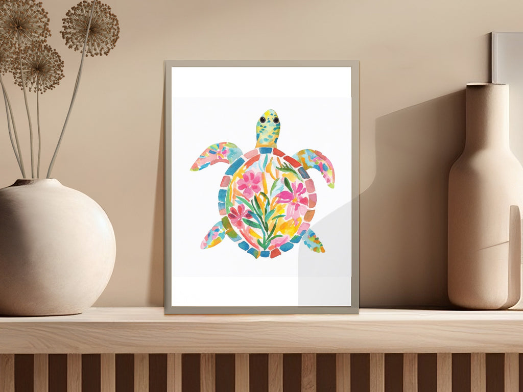 Watercolor sea turtle illustration with floral accents in a picture frame.