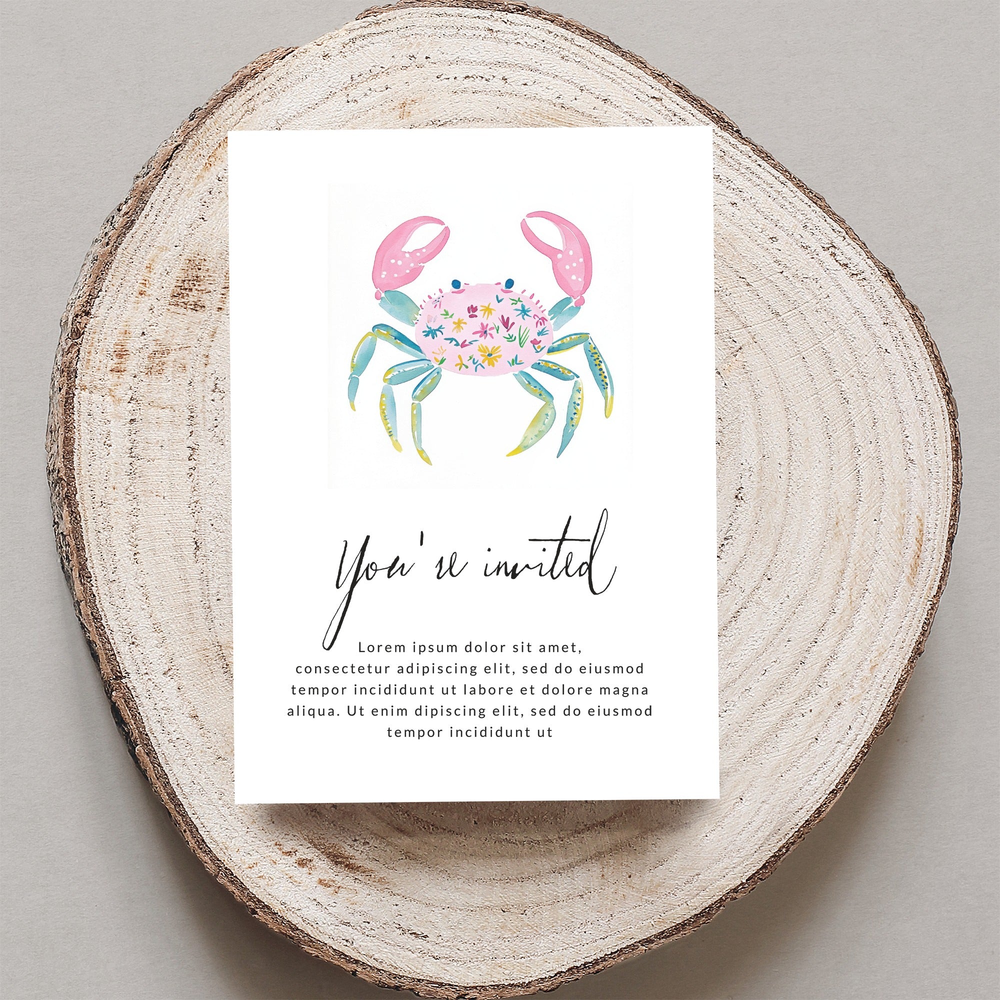 Watercolor invitation with pink crab illustration and "You're invited" text.