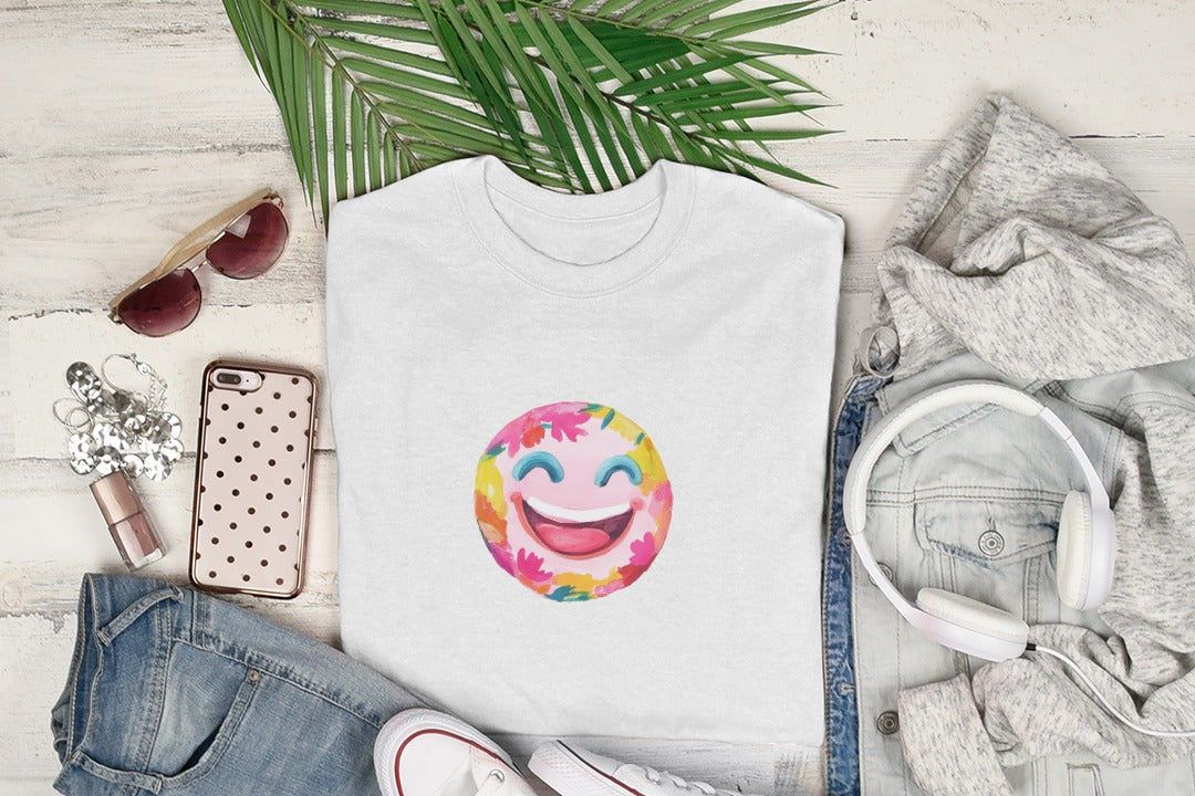 White t-shirt with a colorful, floral smiley face graphic.