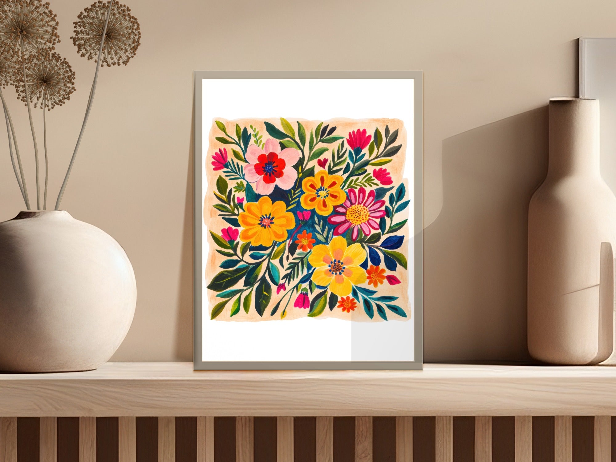 Framed floral art with colorful flowers on a beige wall.