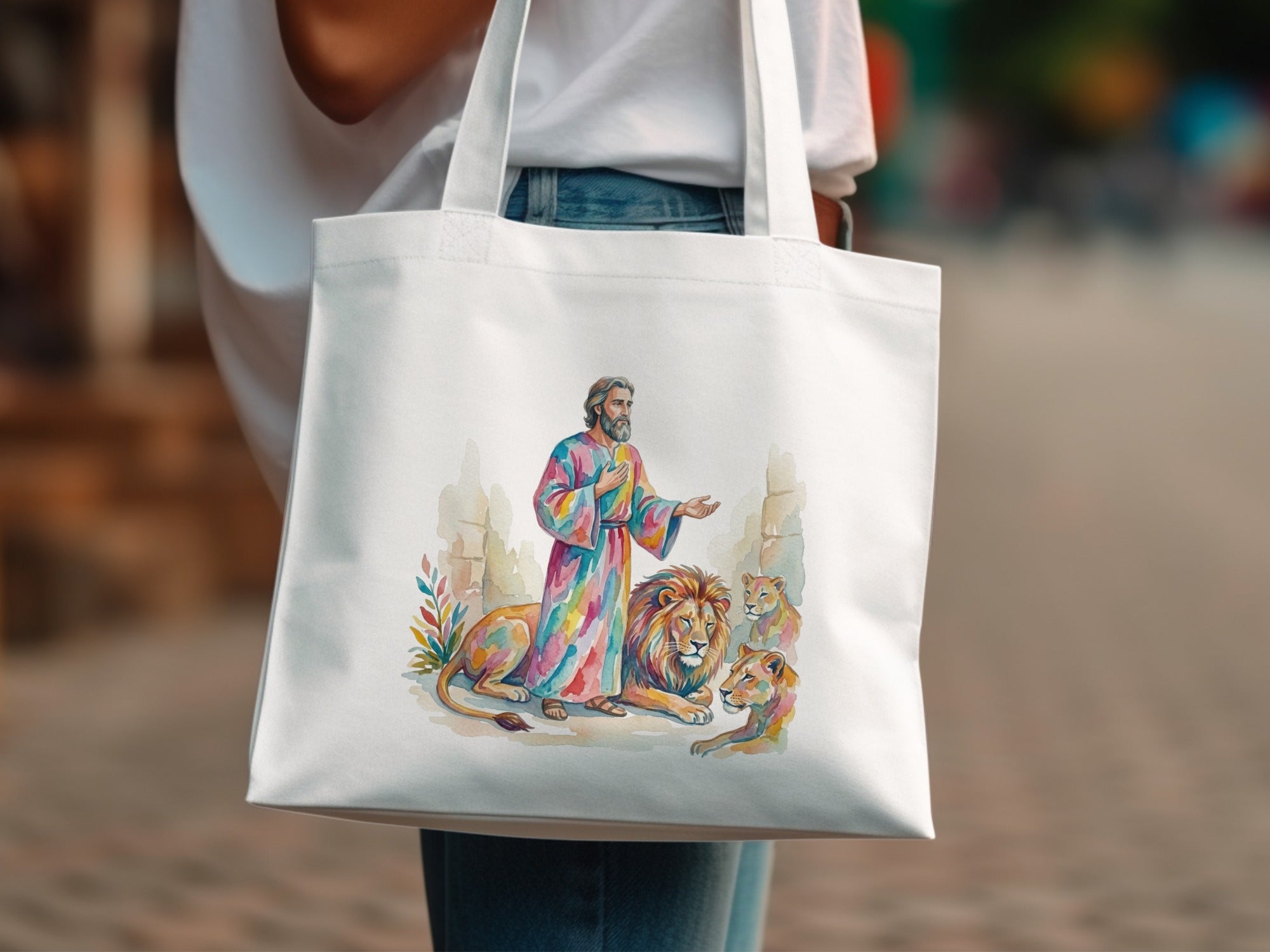 Jesus with lions watercolor art on a white tote bag.