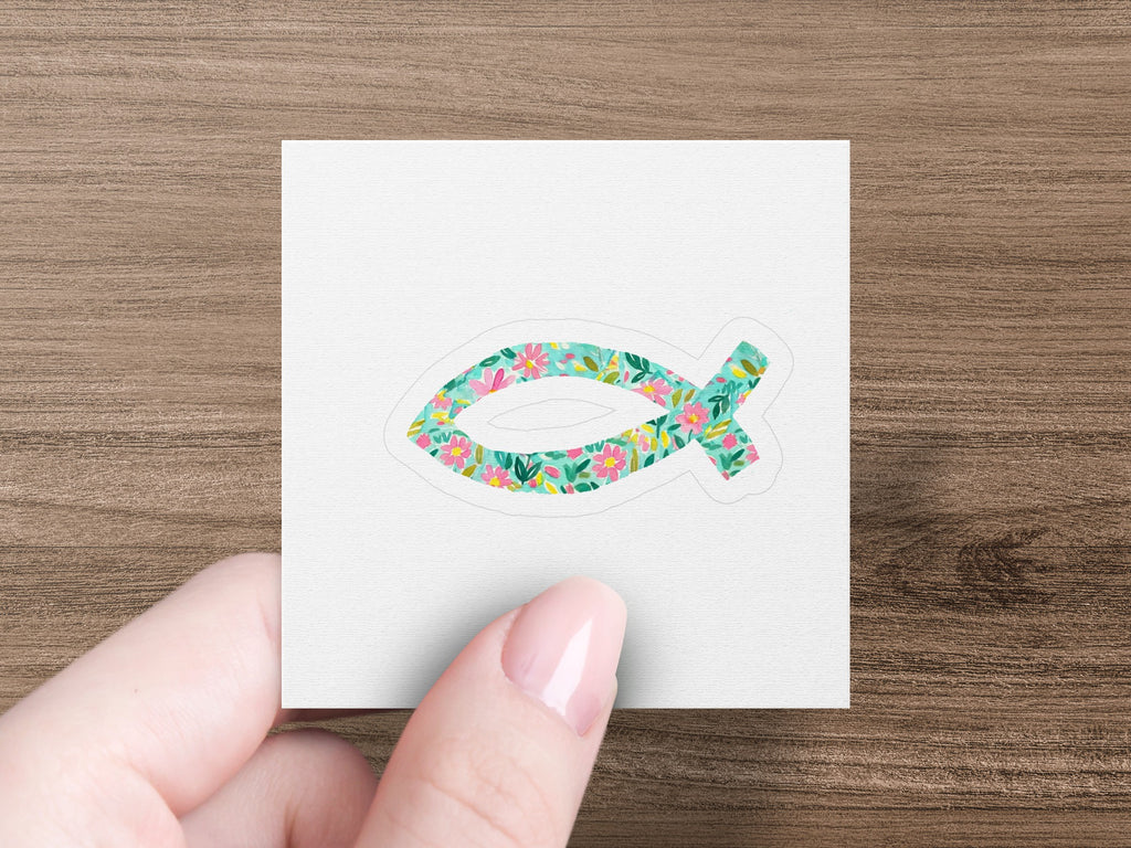 Jesus fish symbol with a floral pattern on a white background.