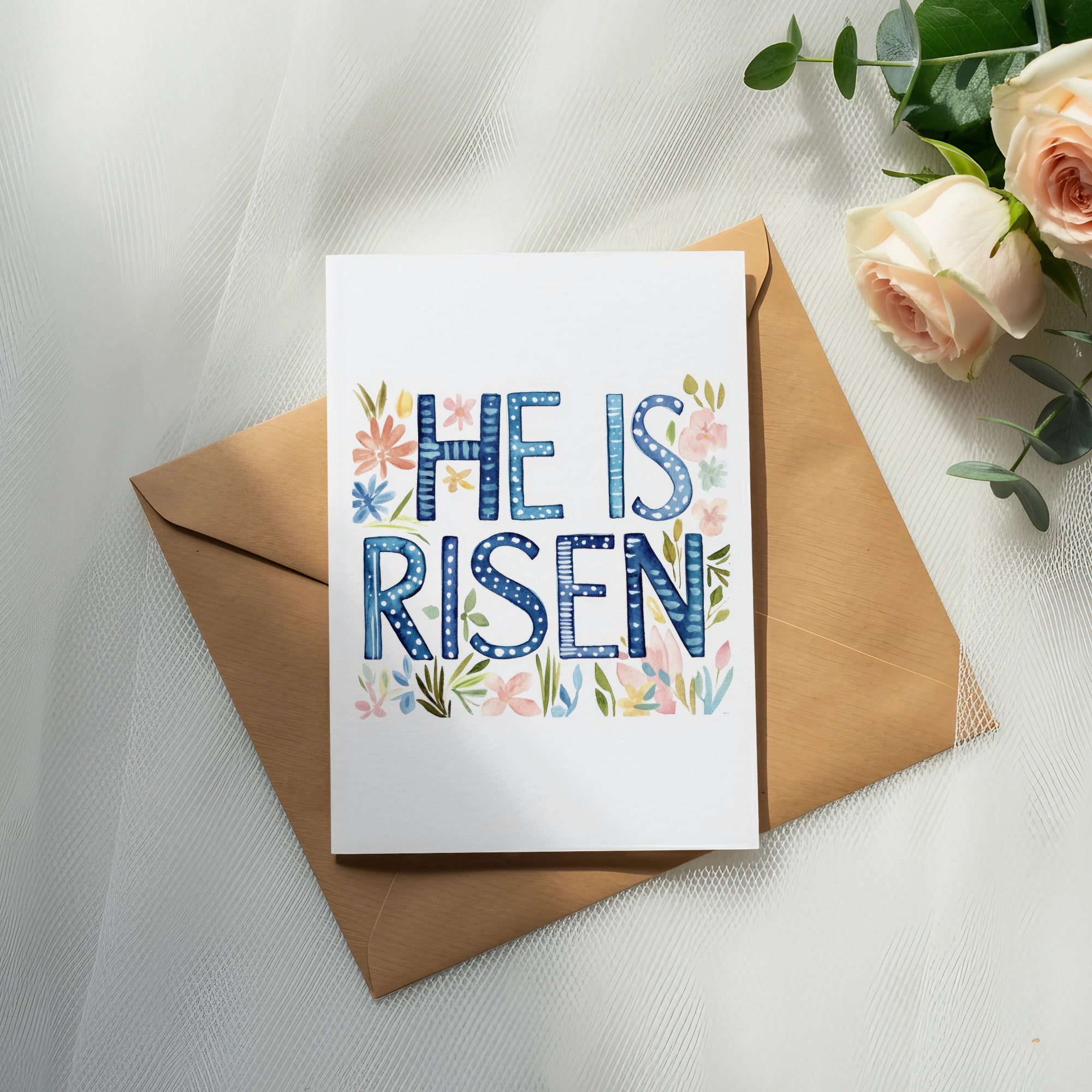 Card with "He is Risen" in decorative lettering and floral accents.