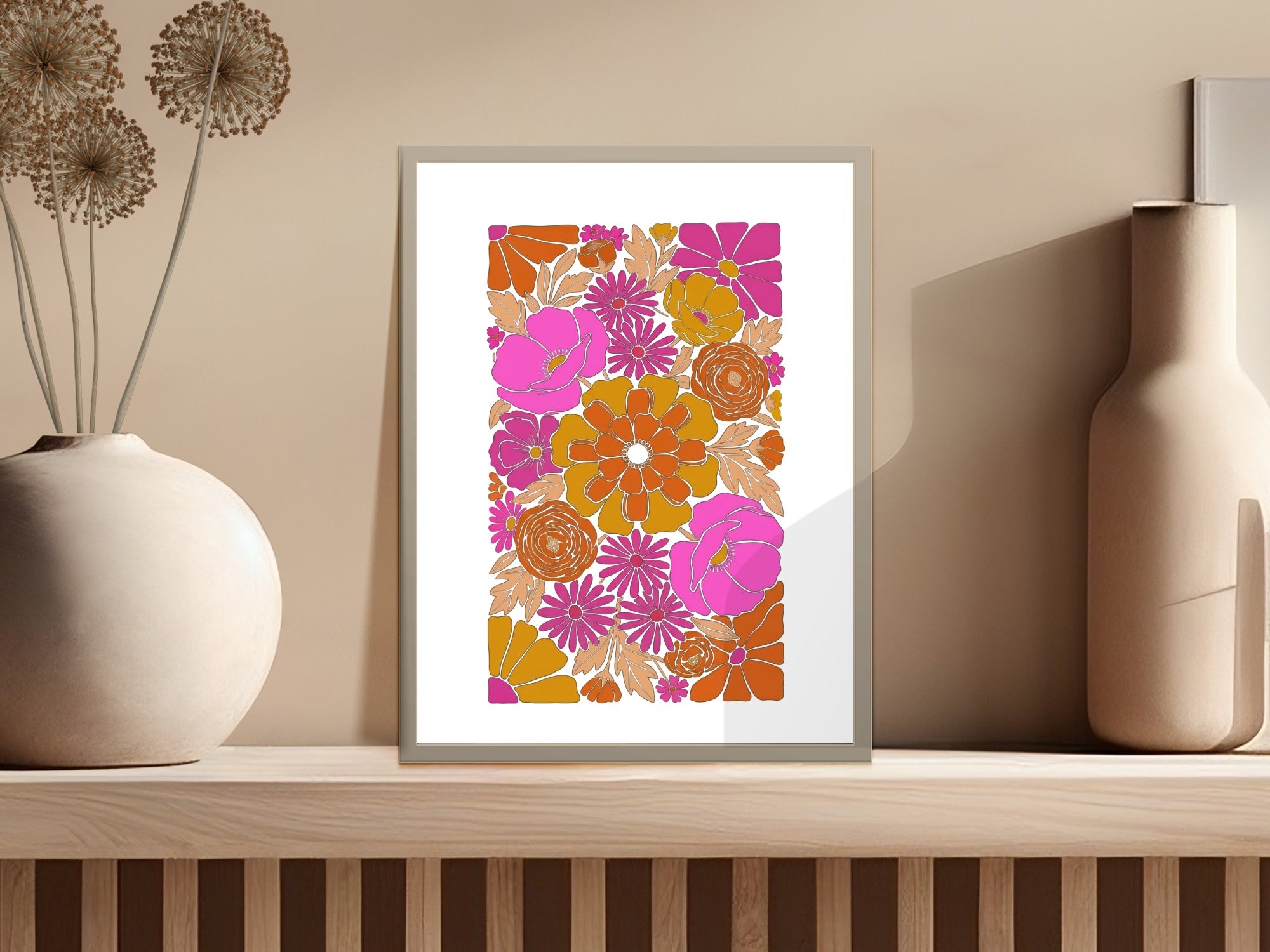 Retro floral art print in a silver frame with pink and orange flowers.