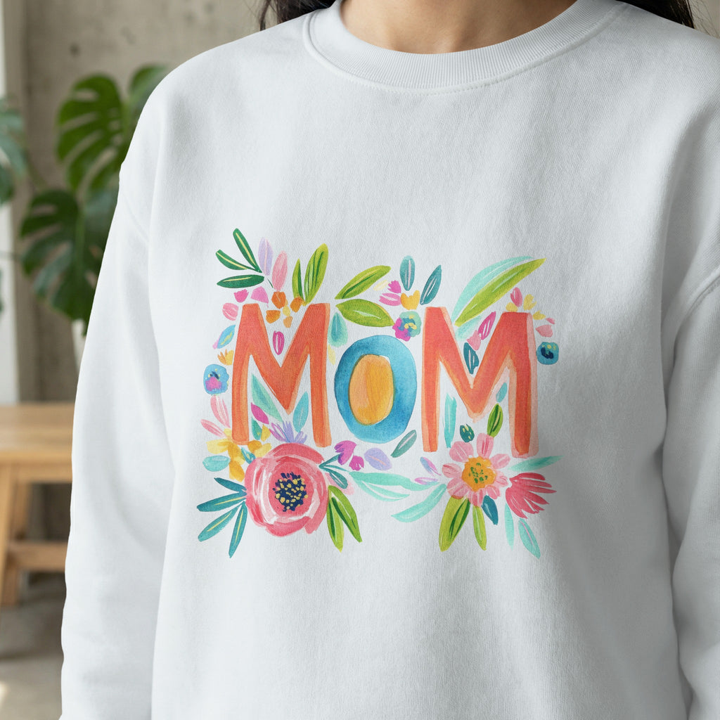 White sweatshirt with colorful floral "MOM" graphic.