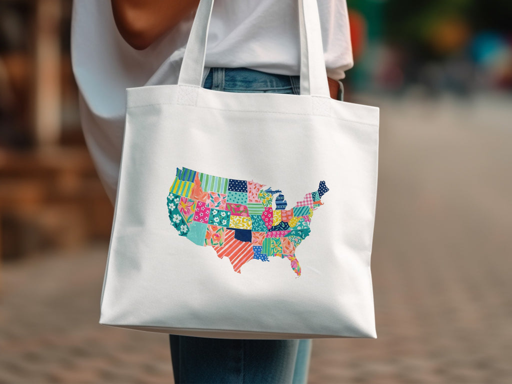 White tote bag with a colorful patchwork map of the United States.