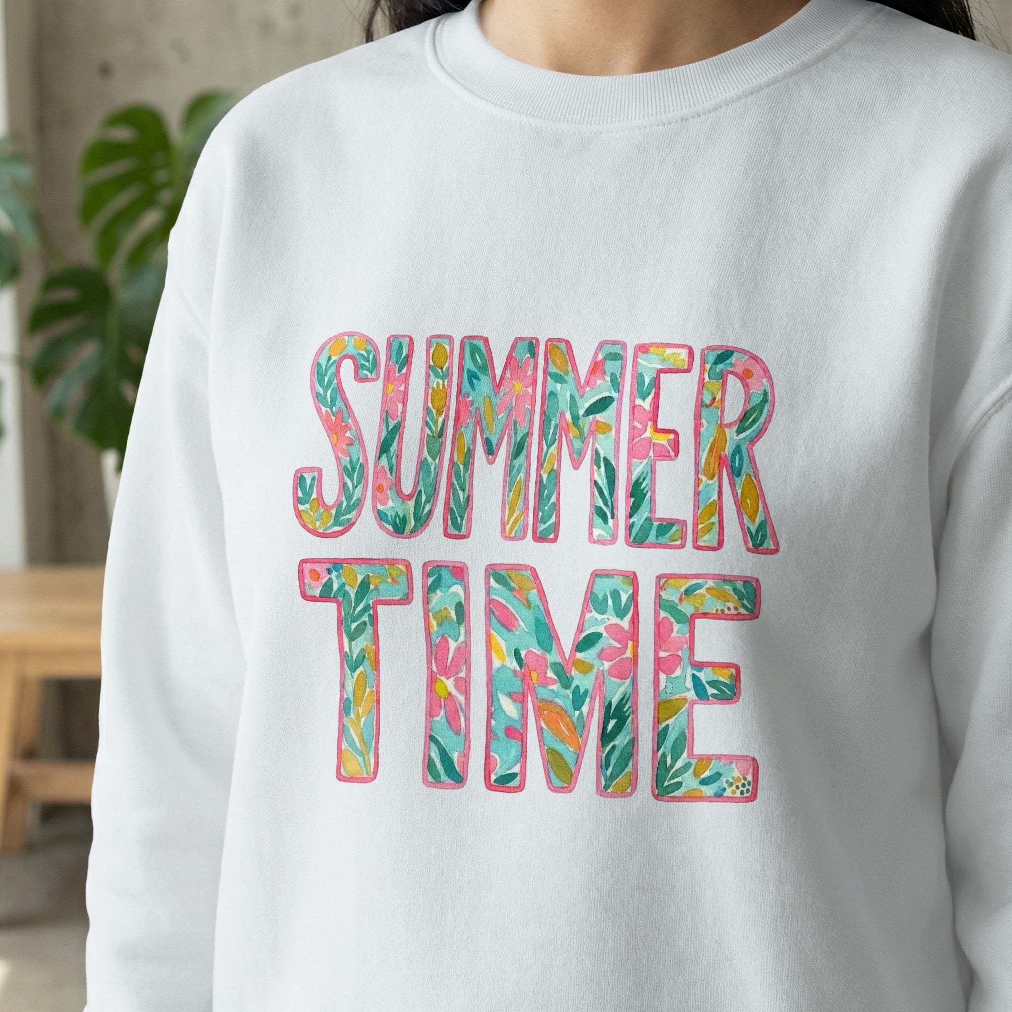 White sweatshirt with colorful floral "Summer Time" text.