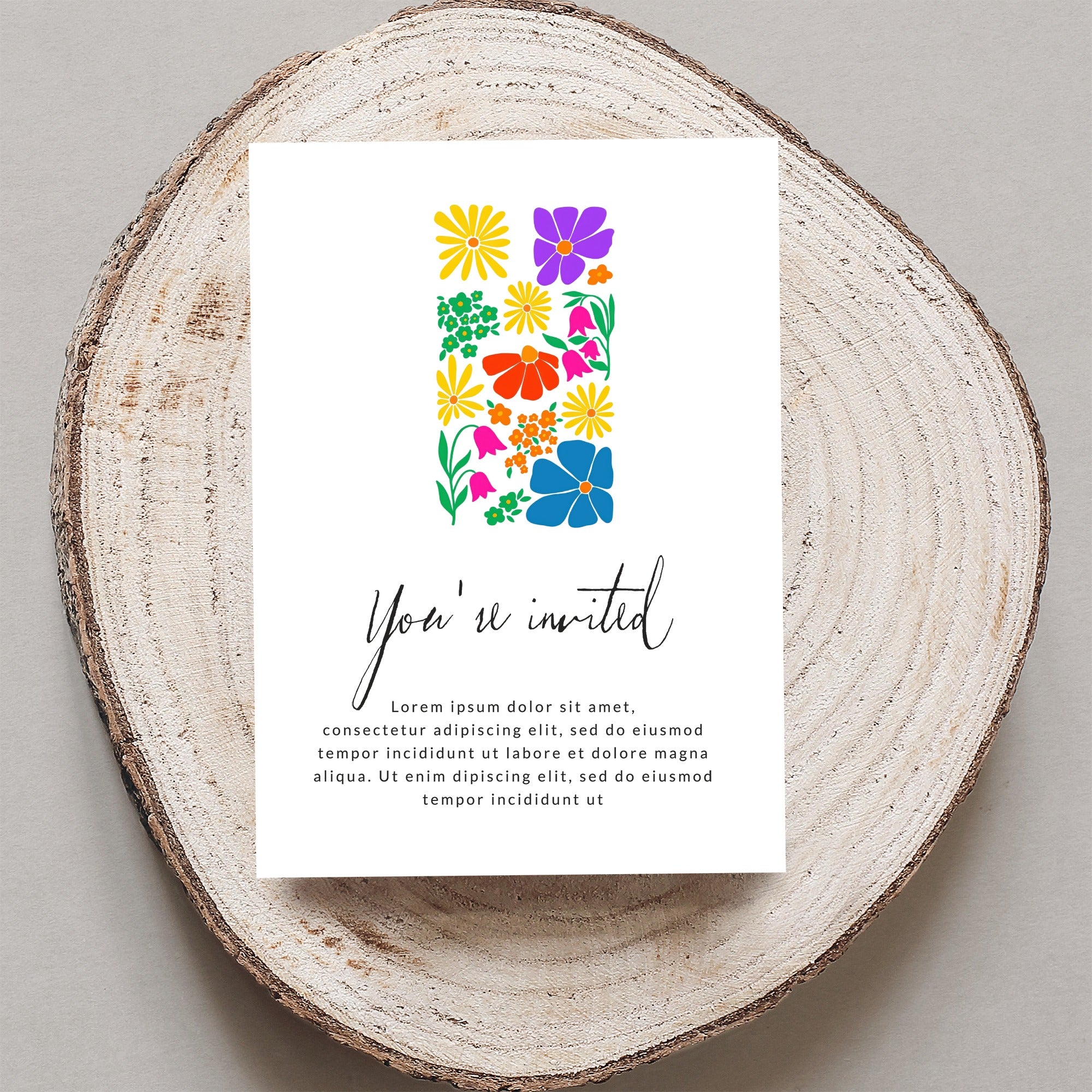Invitation card with colorful floral design and "You're invited" text.